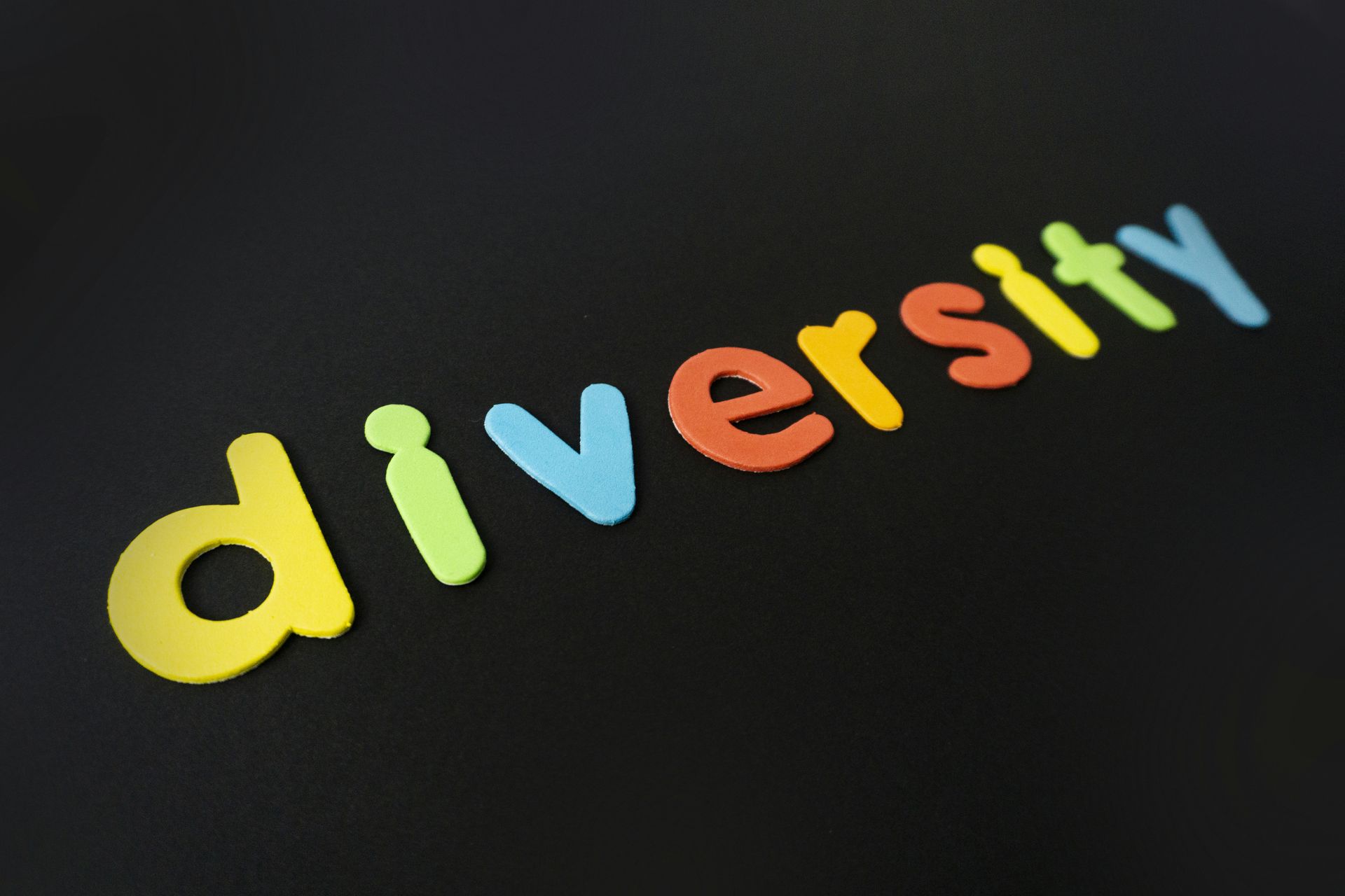 Colorful “diversity” letters on a black background