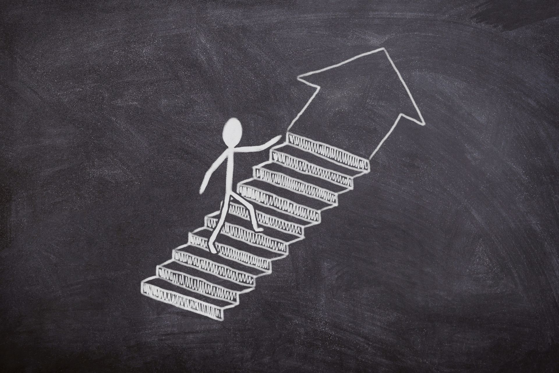 A stick figure is walking up a set of stairs with an arrow pointing up.
