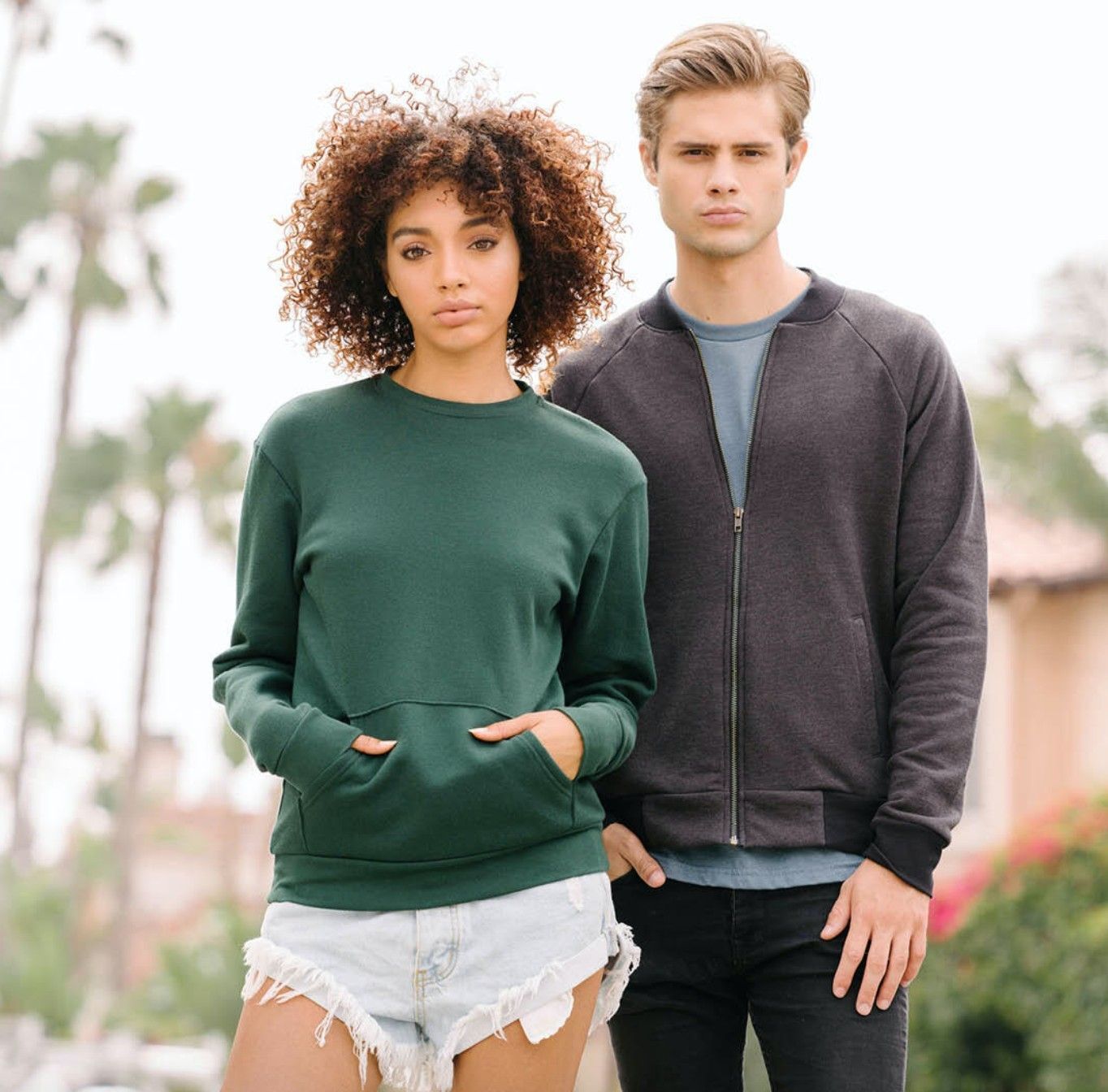 A man and a woman are standing next to each other.
