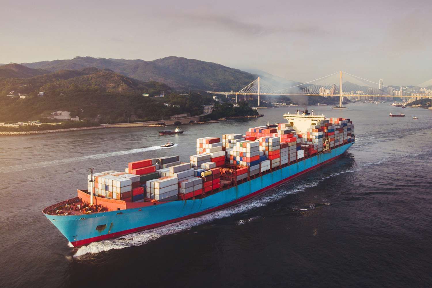 An aerial view of a large container ship floating on top of a body of water.