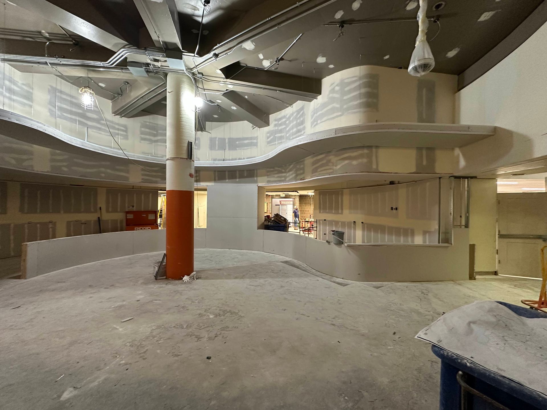 Interior under construction. raw drywall, exposed ductwork.