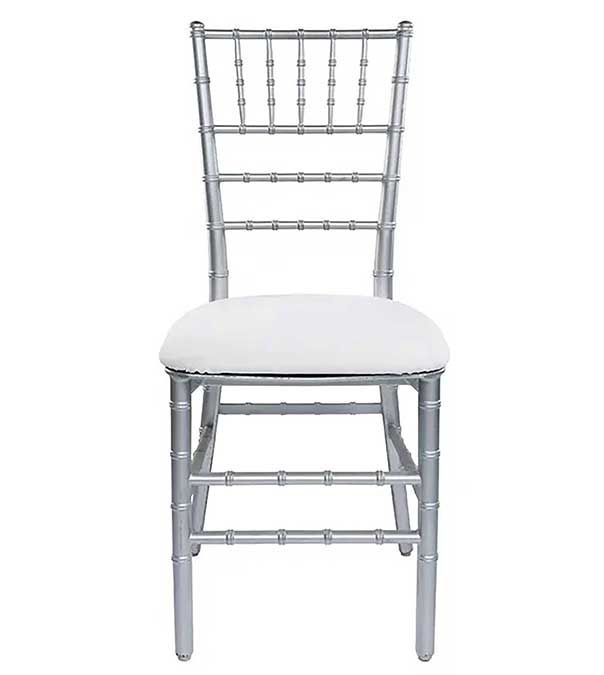 White cushioned Chiavari chair with silver frame and decorative back on a plain white background