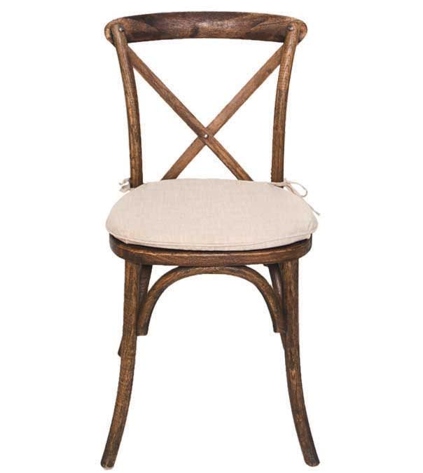 Brown wooden cross-back chair with beige cushioned seat on white background