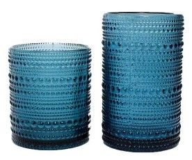 Two blue textured glass vases, one short and one tall, on a white background