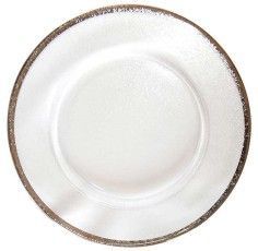 White ceramic plate with a brown-speckled rim on a plain background