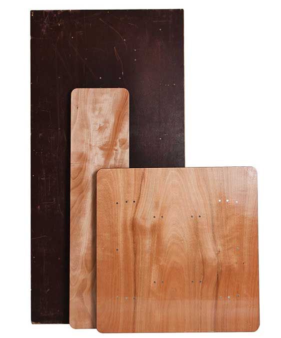 Three overlapping cutting boards in dark brown and light wood tones