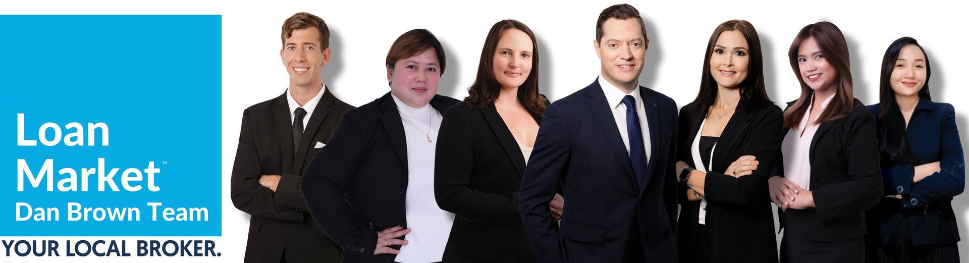 Loan Market team photo with six people beside a blue logo panel reading “Loan Market Dan Brown Team”