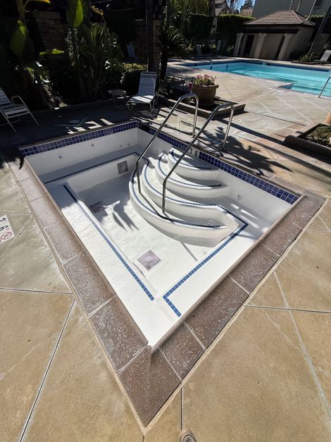 Swimming pools with blue water and diving board; exterior shot. Swimming pools with blue water and diving board; exterior shot.
