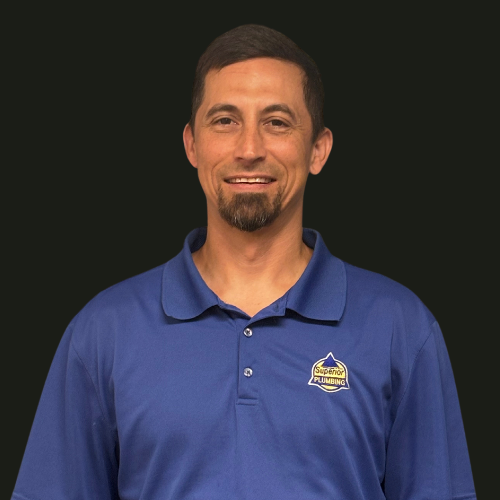 Service Plumber in Blue Collared Shirt