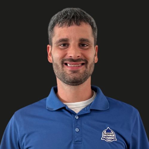 Service Plumber in Blue Collared Shirt