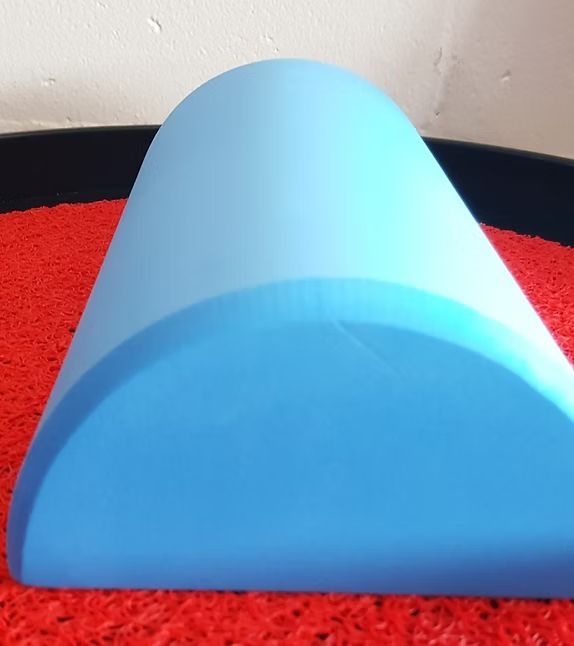 A Blue Cylinder is Sitting on a Red Mat — Anderson Family Chiropractic Health Centre in Mount Pleasant, QLD