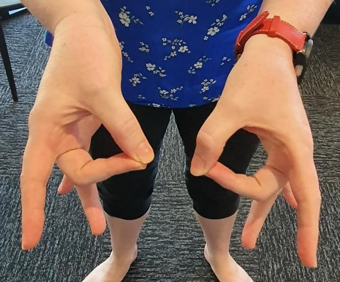 A Person is Demonstrating a Finger Exercise — Anderson Family Chiropractic Health Centre in Mount Pleasant, QLD