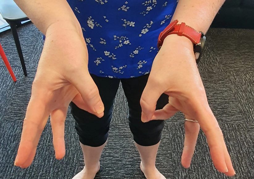 A Person is Demonstrating a Finger Exercise — Anderson Family Chiropractic Health Centre in Mount Pleasant, QLD