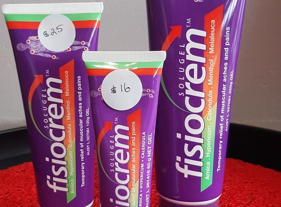 Three Tubes of Fisiocrem Are Sitting on a Table — Anderson Family Chiropractic Health Centre in Mount Pleasant, QLD