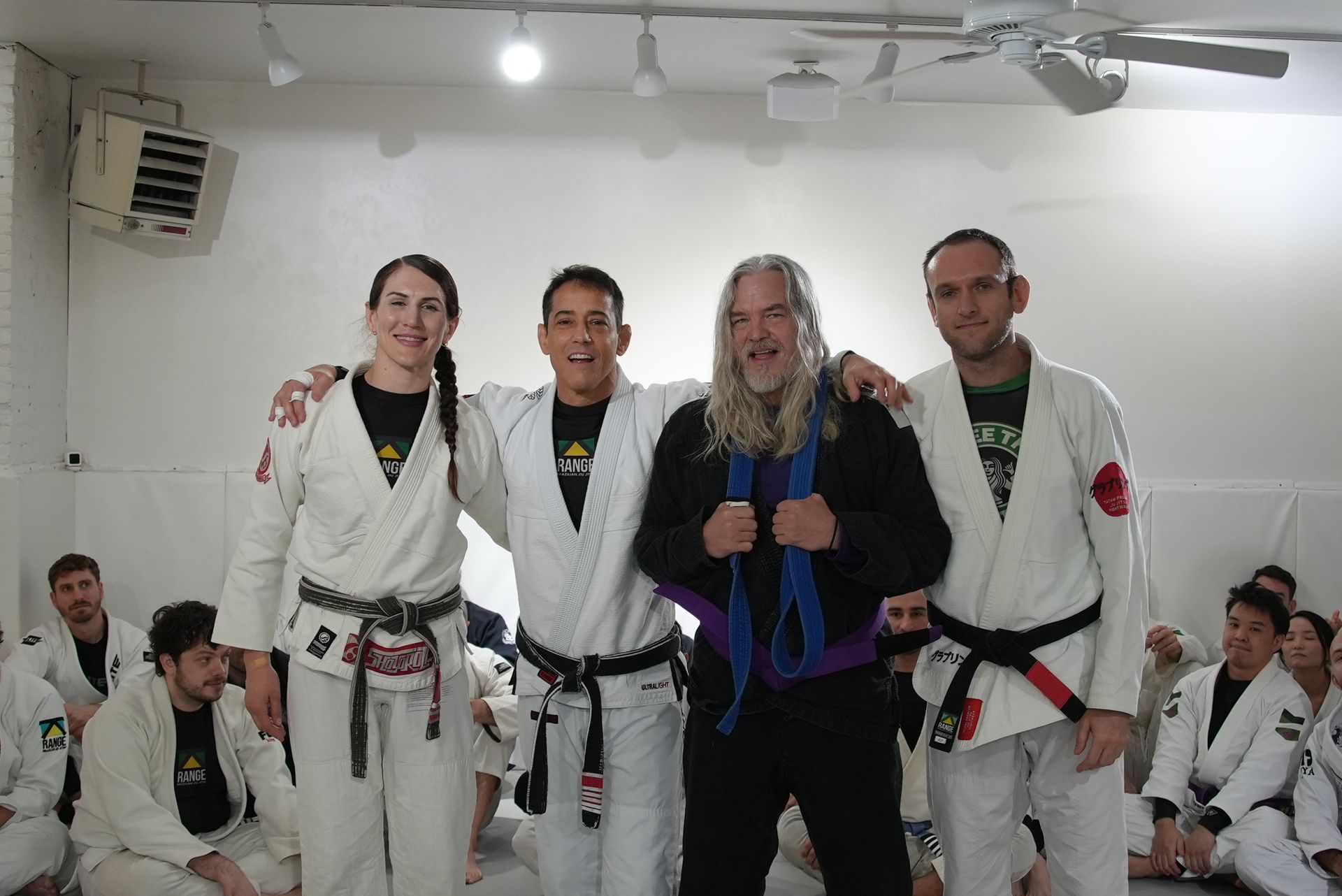 Adult students improving grappling skills through Brazilian Jiu-Jitsu training at Range Brazilian Jiu-Jitsu NYC.