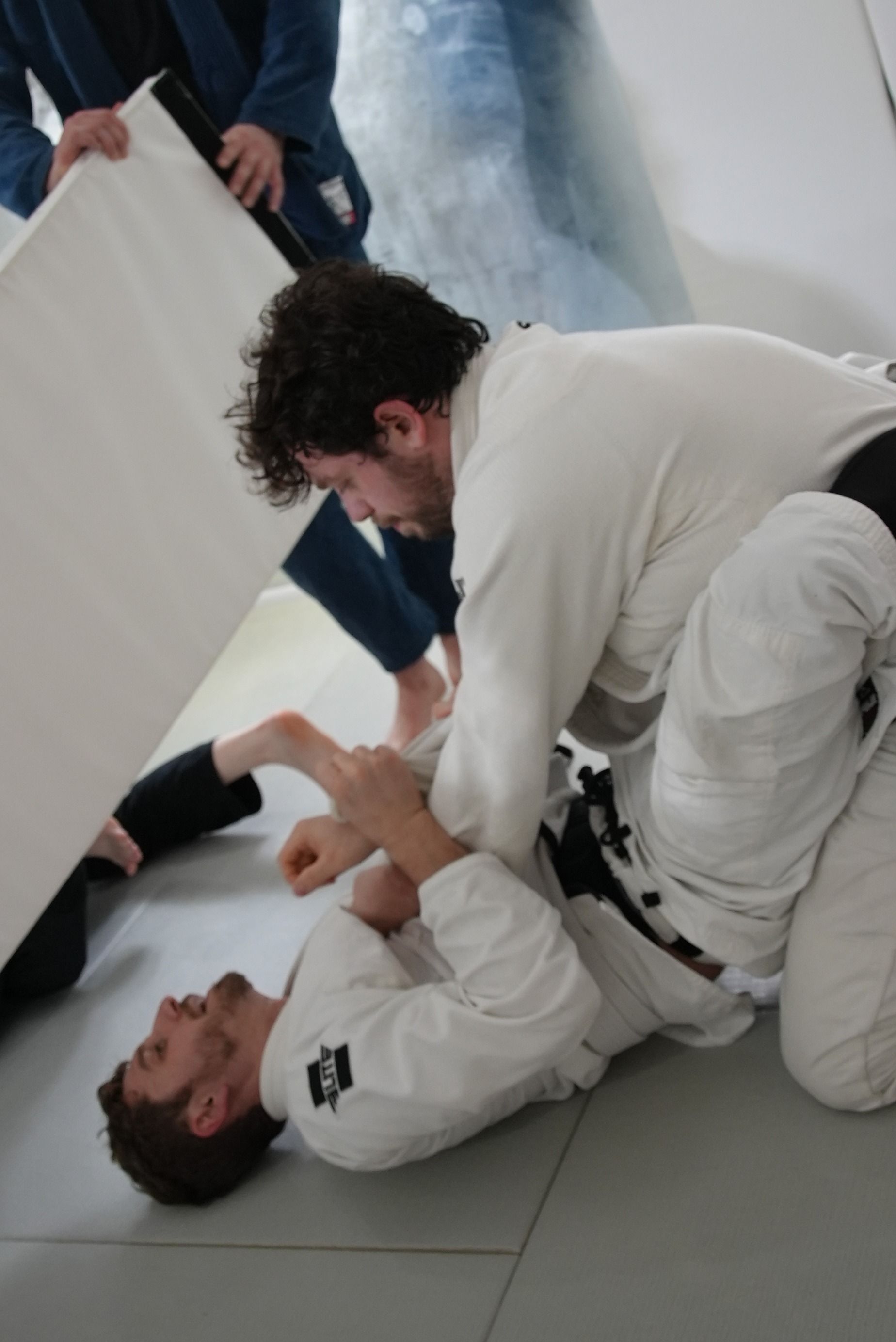 Adults drilling Brazilian Jiu-Jitsu fundamentals at Range Brazilian Jiu-Jitsu NYC in New York, building fitness and confidence.