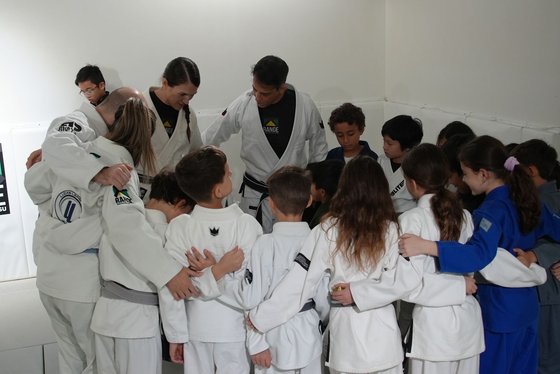 Kids practicing Youth Brazilian Jiu-Jitsu drills at Range Brazilian Jiu-Jitsu NYC in New York, building fitness and friendships.