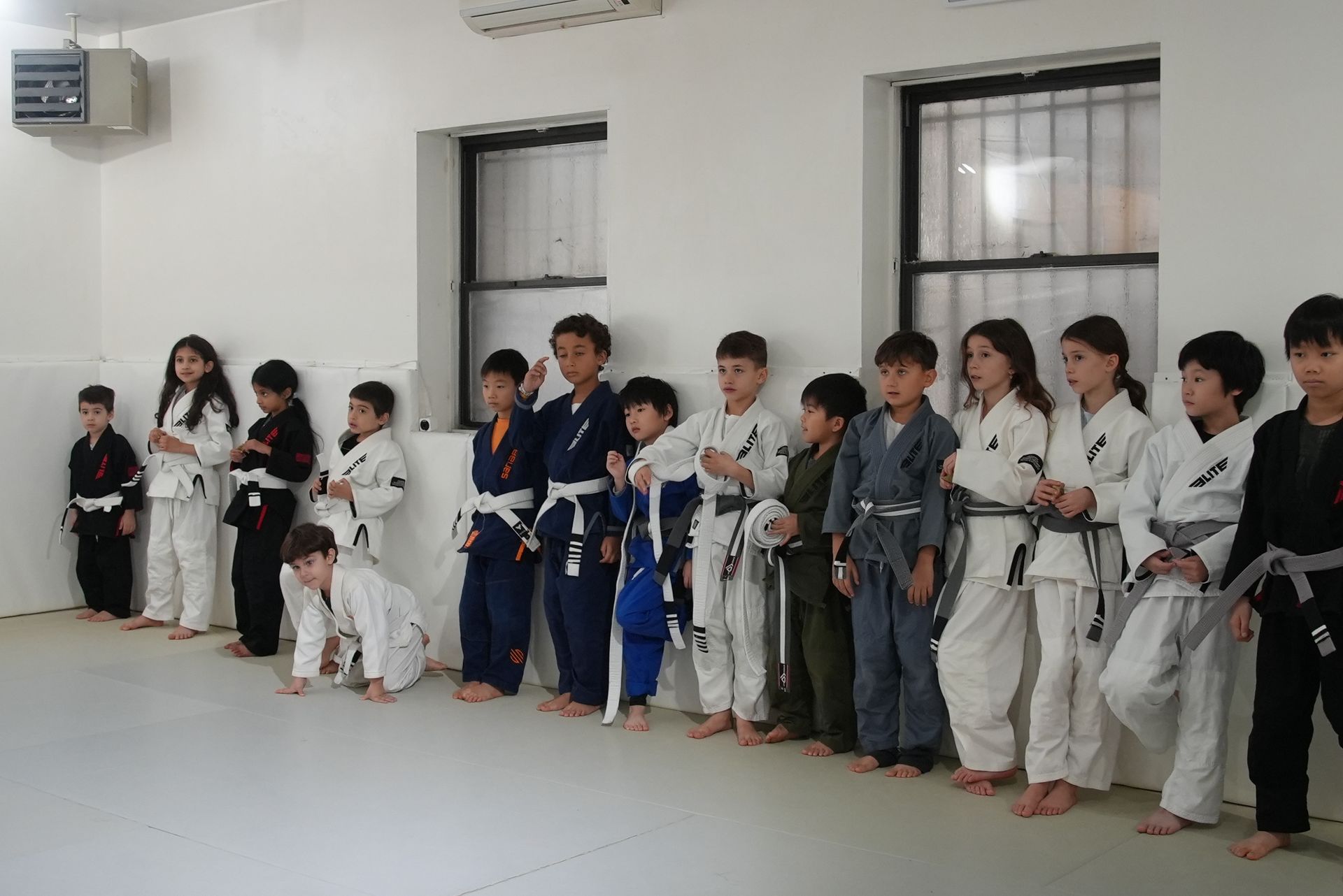 Kids practice partner drills at Range Brazilian Jiu-Jitsu NYC in New York, building communication and respect.