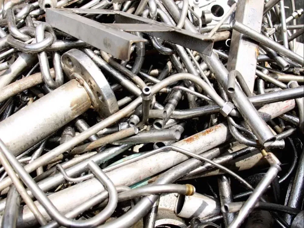 Pile of assorted metal bolts, screws, and fasteners in silver and gray tones