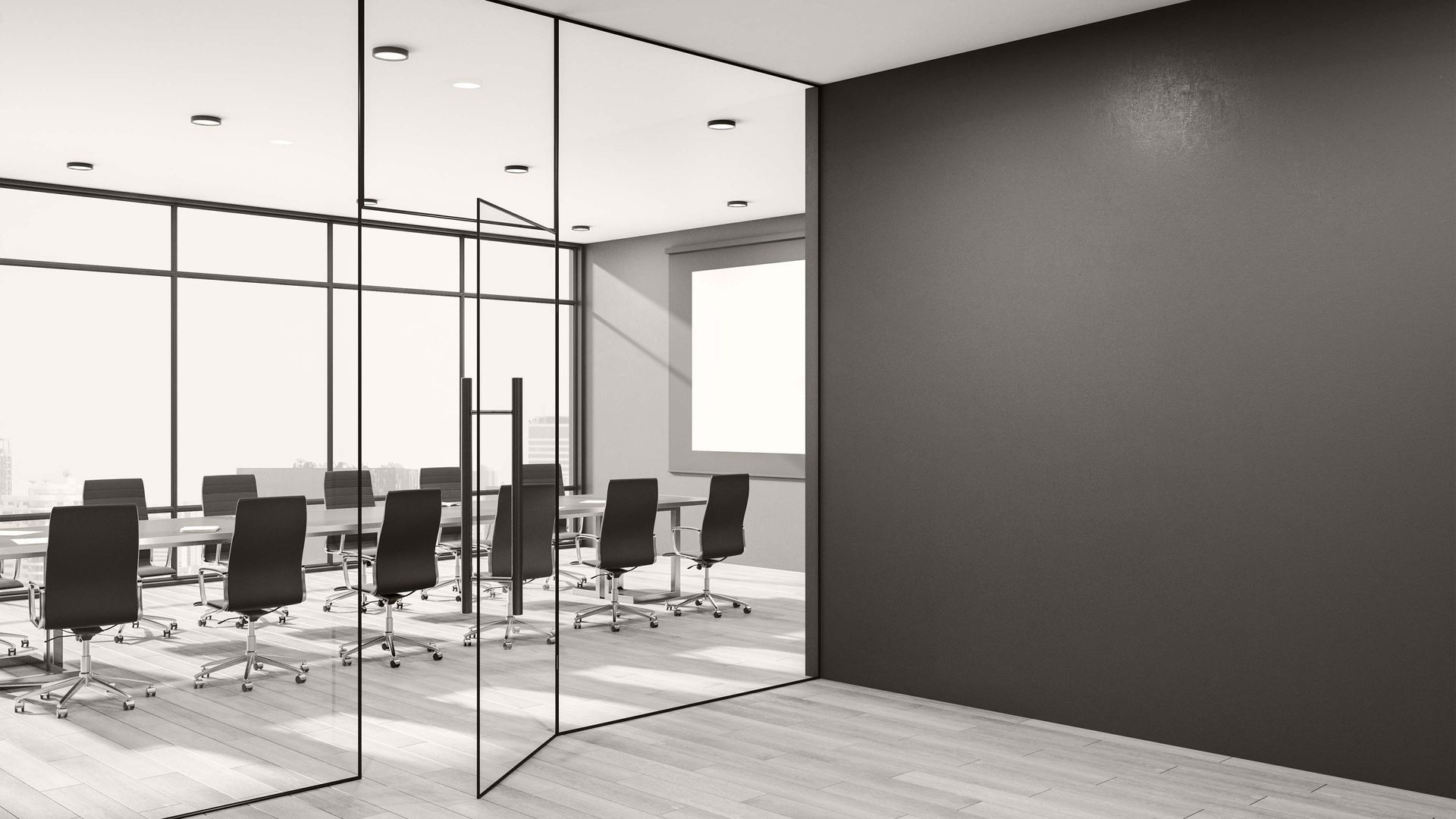 Modern glass-walled conference room with black chairs around a long table and a dark accent wall