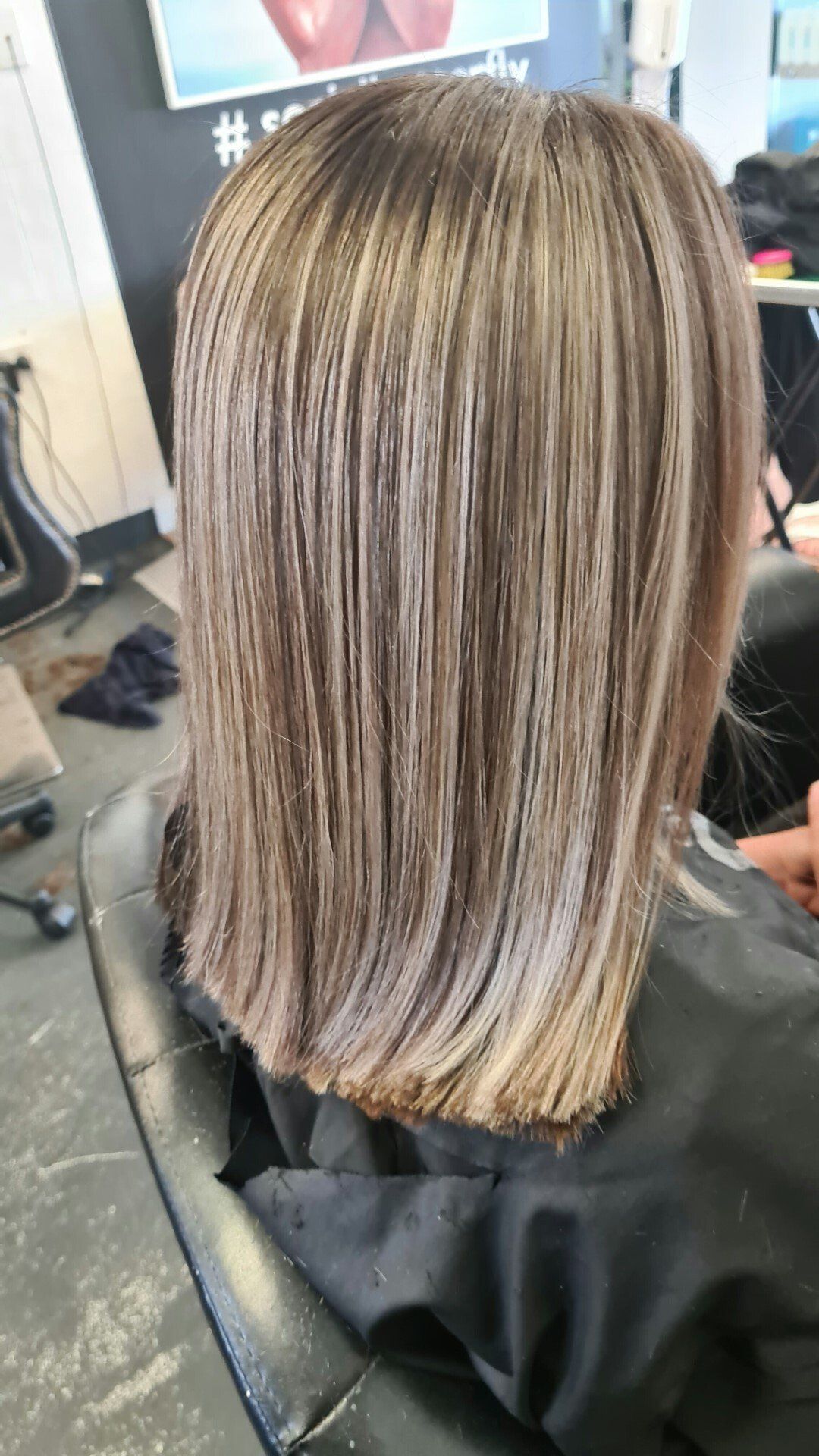 Back view of a bleached with highlights.
