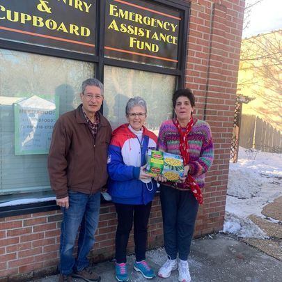 three people in front of pantry