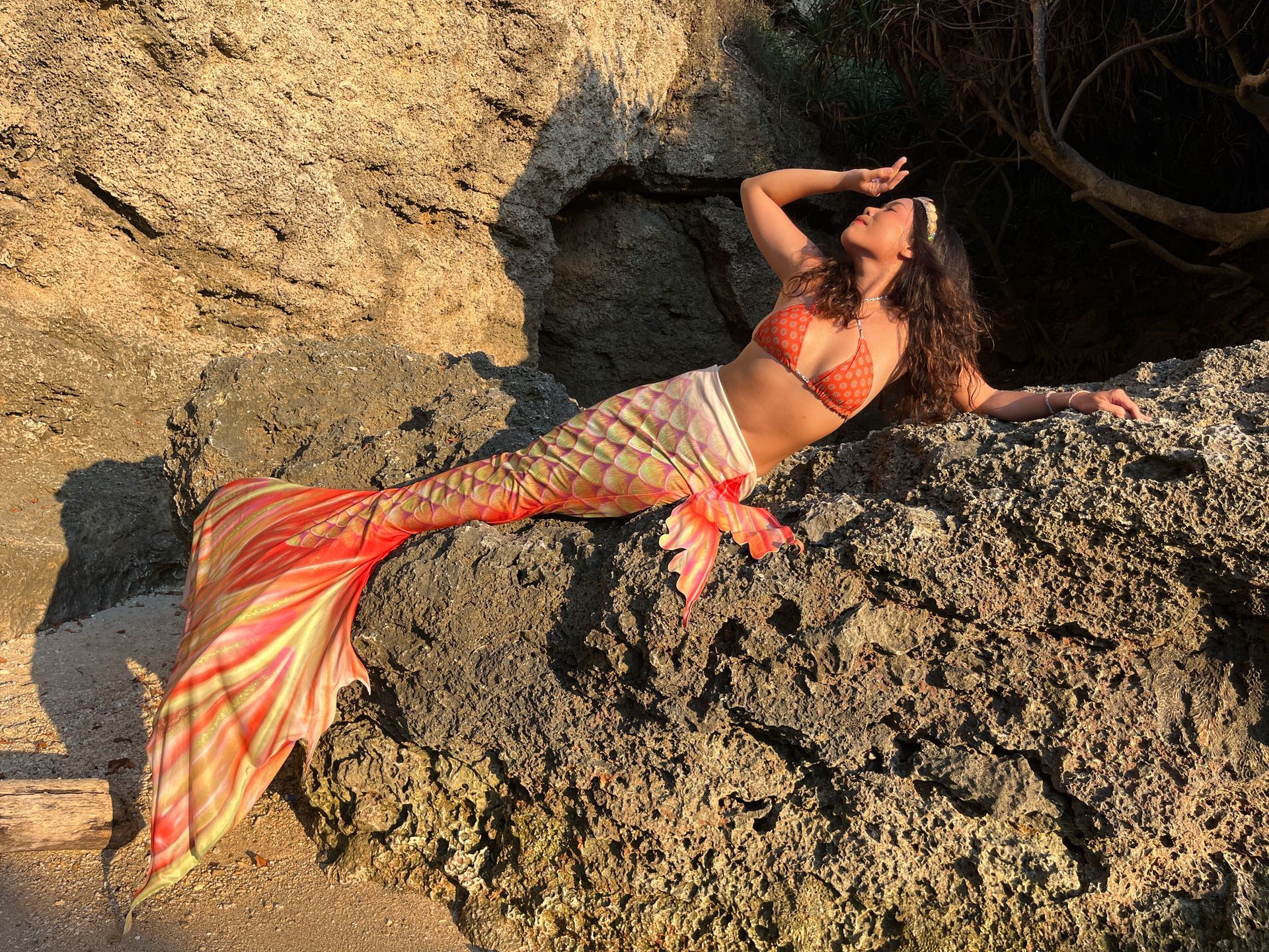 Woman in a bikini smiling before a mermaid dive in Xiaoliuqiu