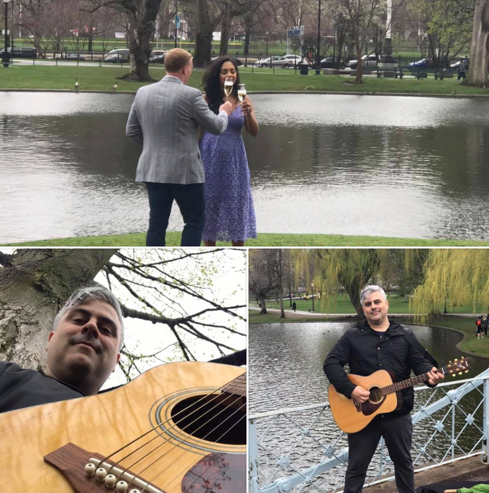 A man playing a guitar in front of a lake