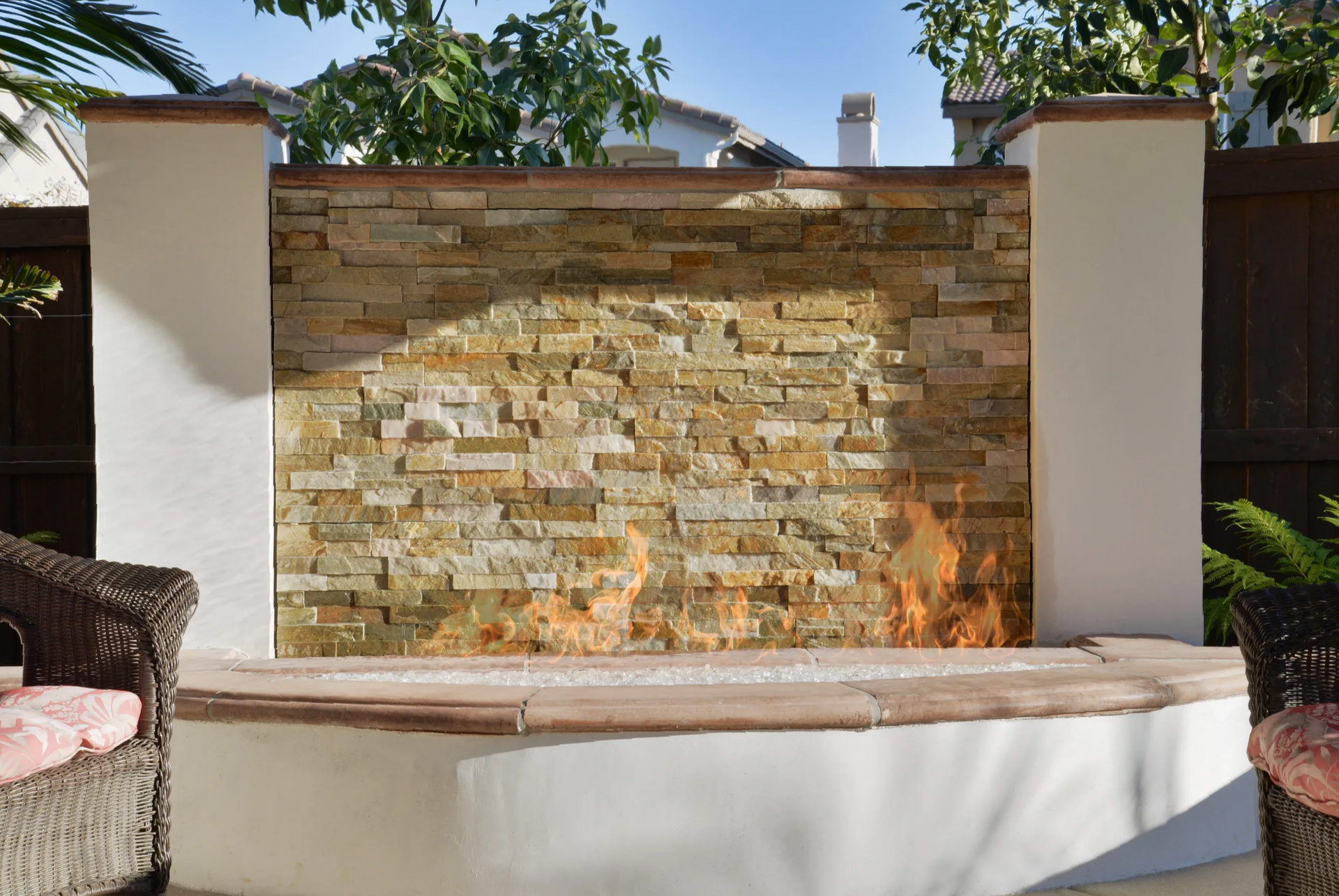 A brick wall with a fire coming out of it