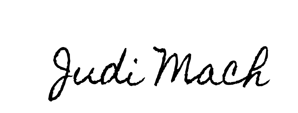 A handwritten signature of judi mack on a white background.