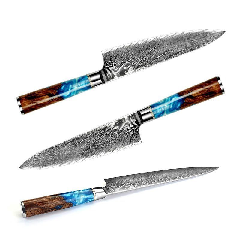 A Damascus steel chef's knife with a blue and wood-grained resin handle displayed next to an open black and red gift box.