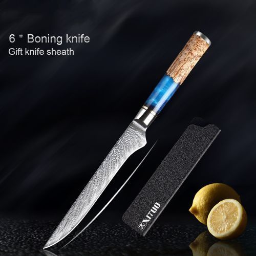 A 6-inch boning knife with a textured blade, resin and wood handle, and a black sheath next to two lemons.