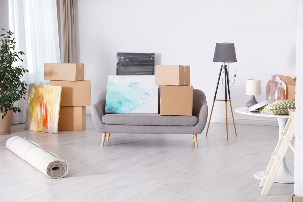 A Living Room Filled With Boxes And A Couch — Ahern's Removals In Byron Bay, NSW