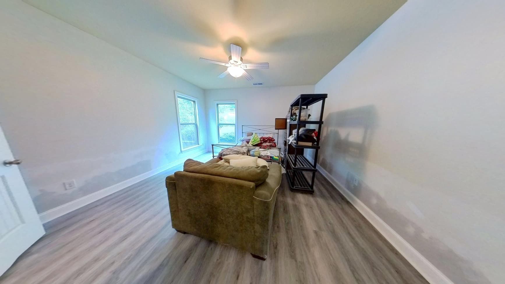 Restored bedroom with new dry flooring after flood cleanup by The Homestar Group