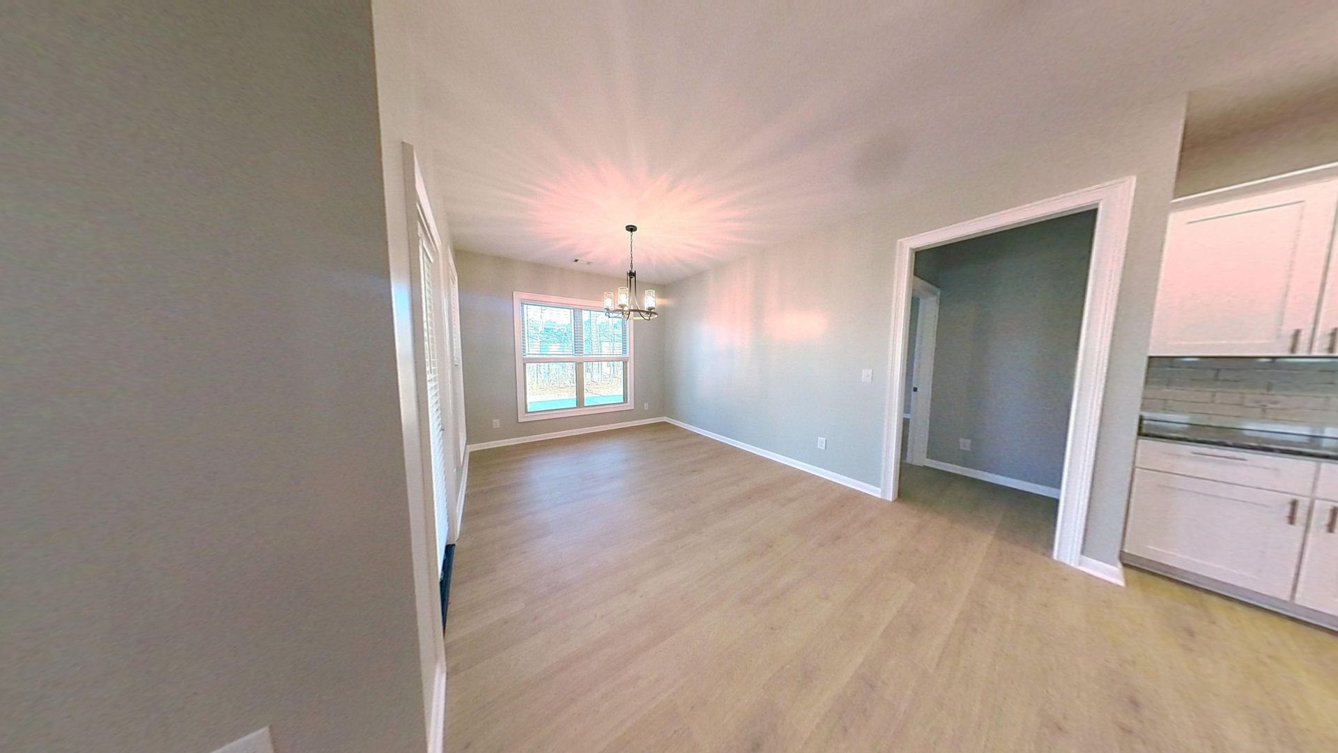 Dining room after fire damage restoration with fresh paint and new flooring