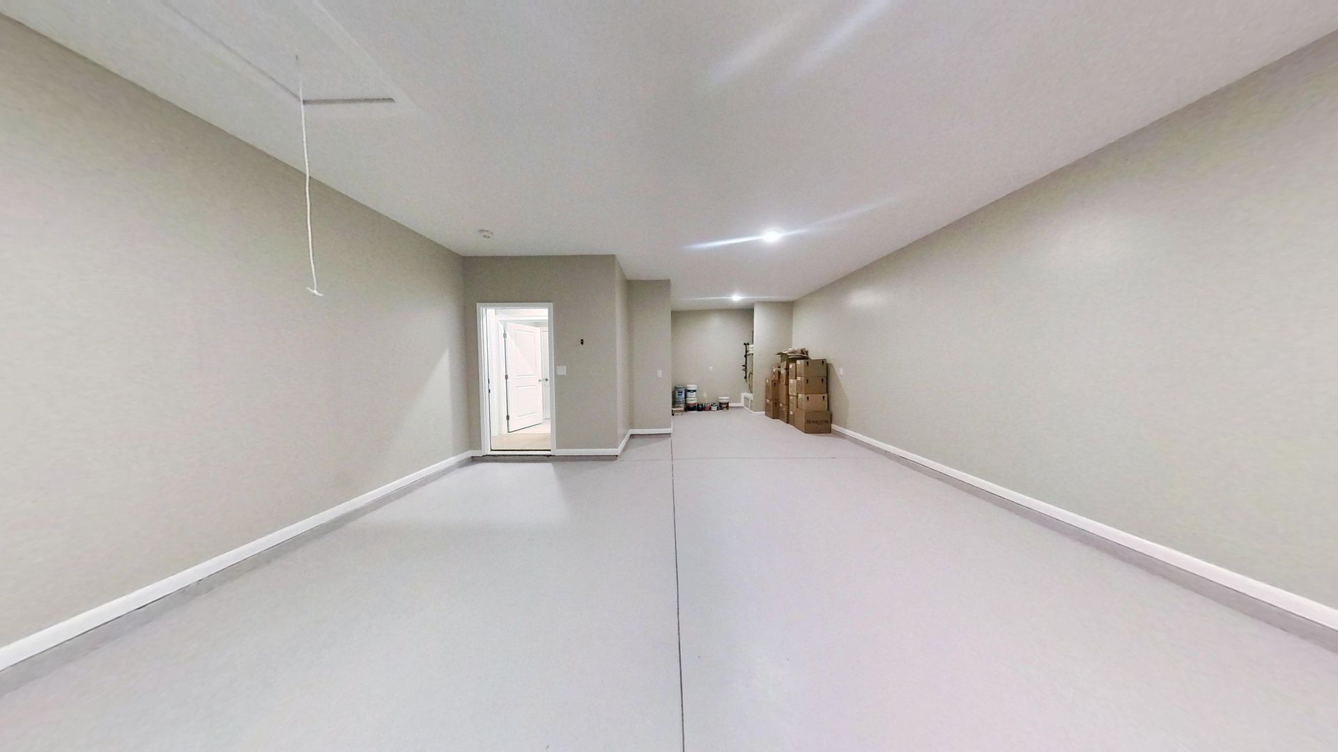 Main living area after fire damage restoration with new walls and flooring