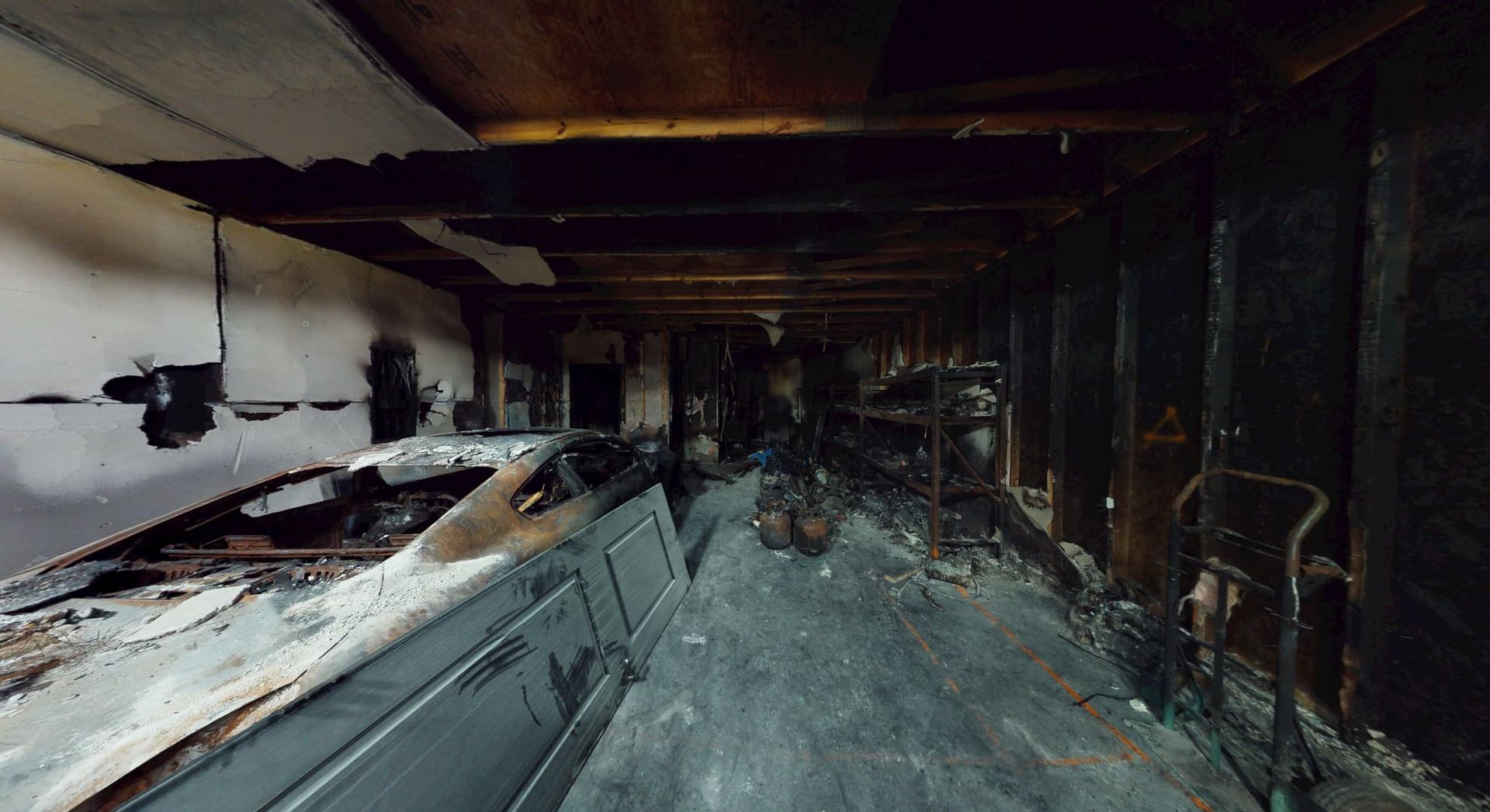 Main living area before fire damage restoration showing heavy soot
