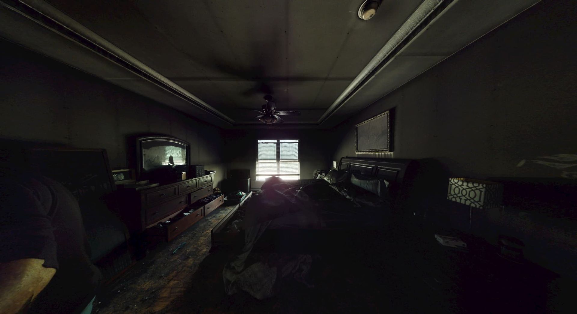 Bedroom before fire damage restoration showing blackened walls and ceiling