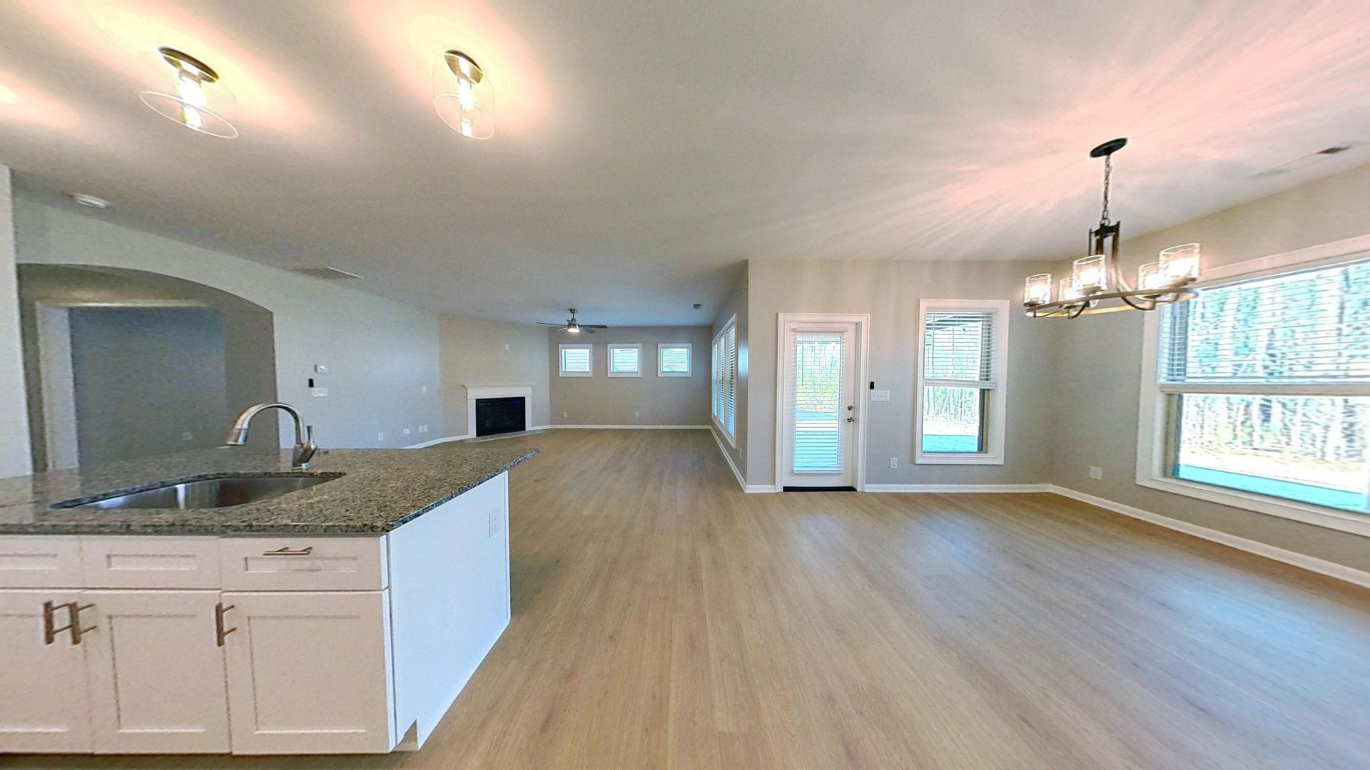 Kitchen area after fire restoration with new cabinets and countertops