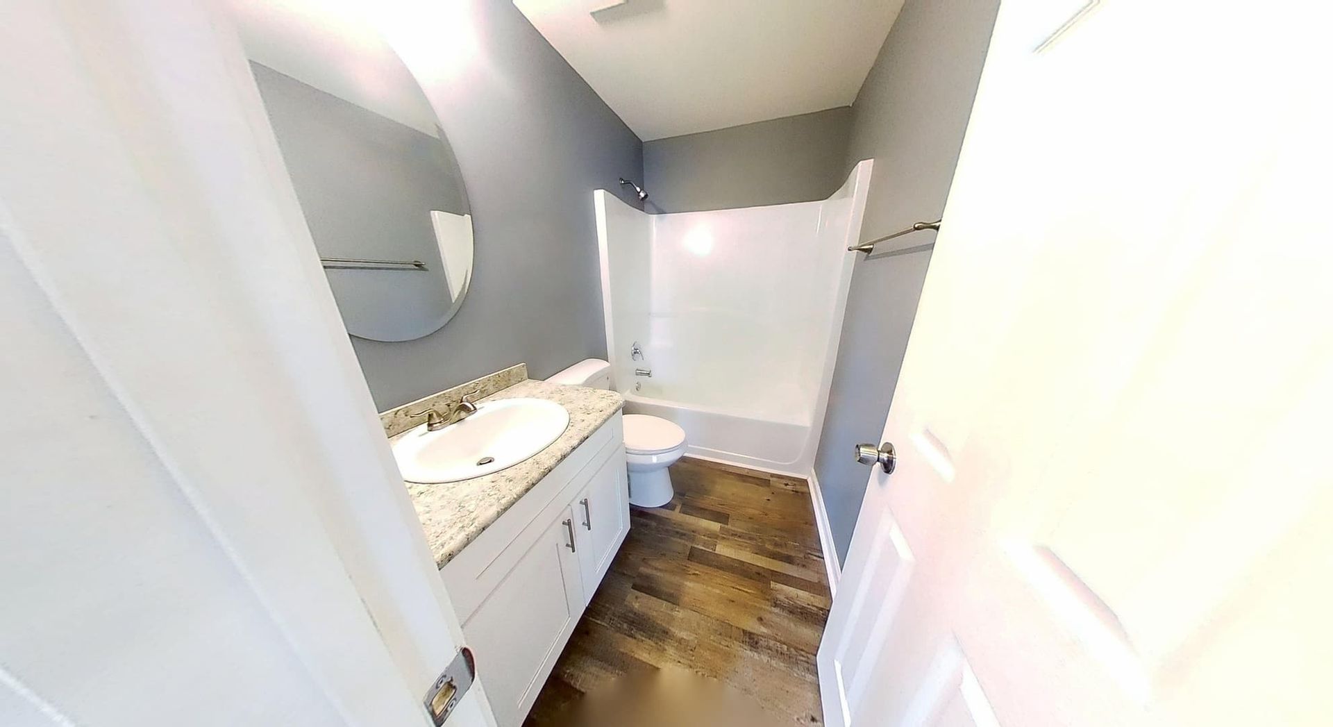 Restored master bathroom after fire damage restoration in Loganville GA with new tile and fixtures