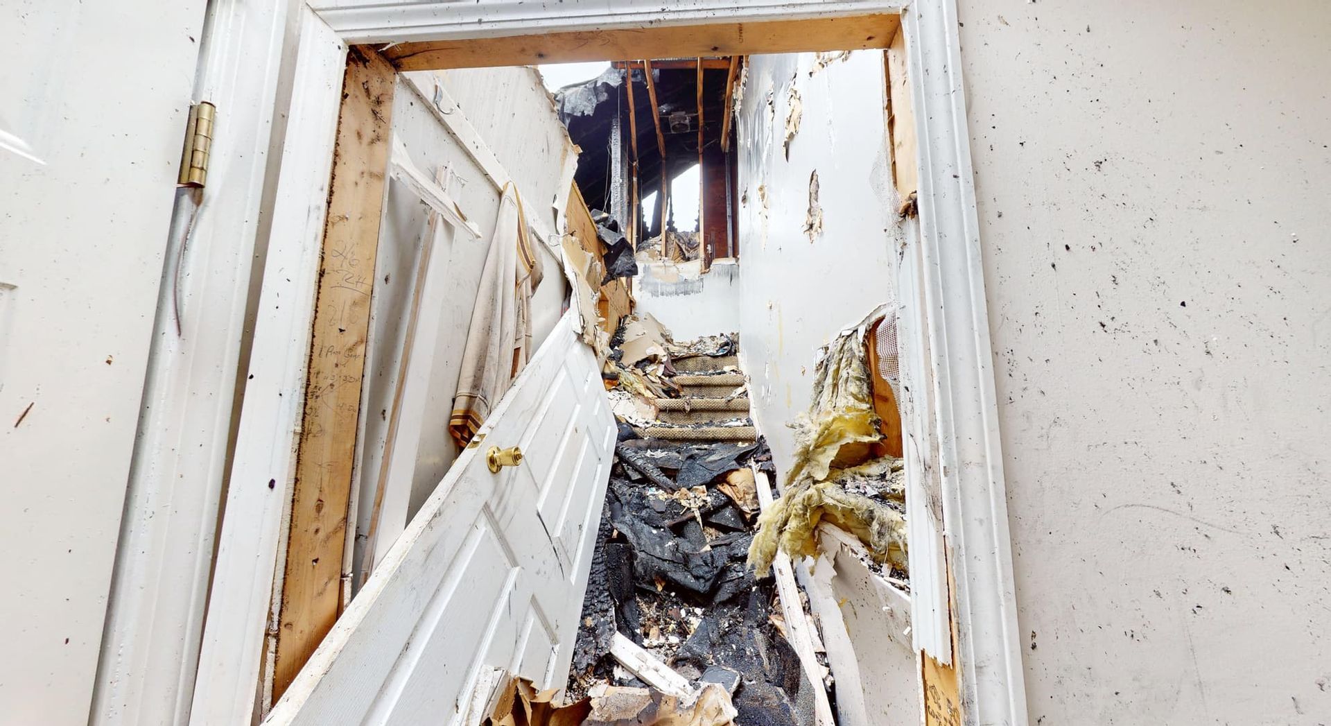 Fire damaged staircase with structural concerns before restoration in Loganville GA home