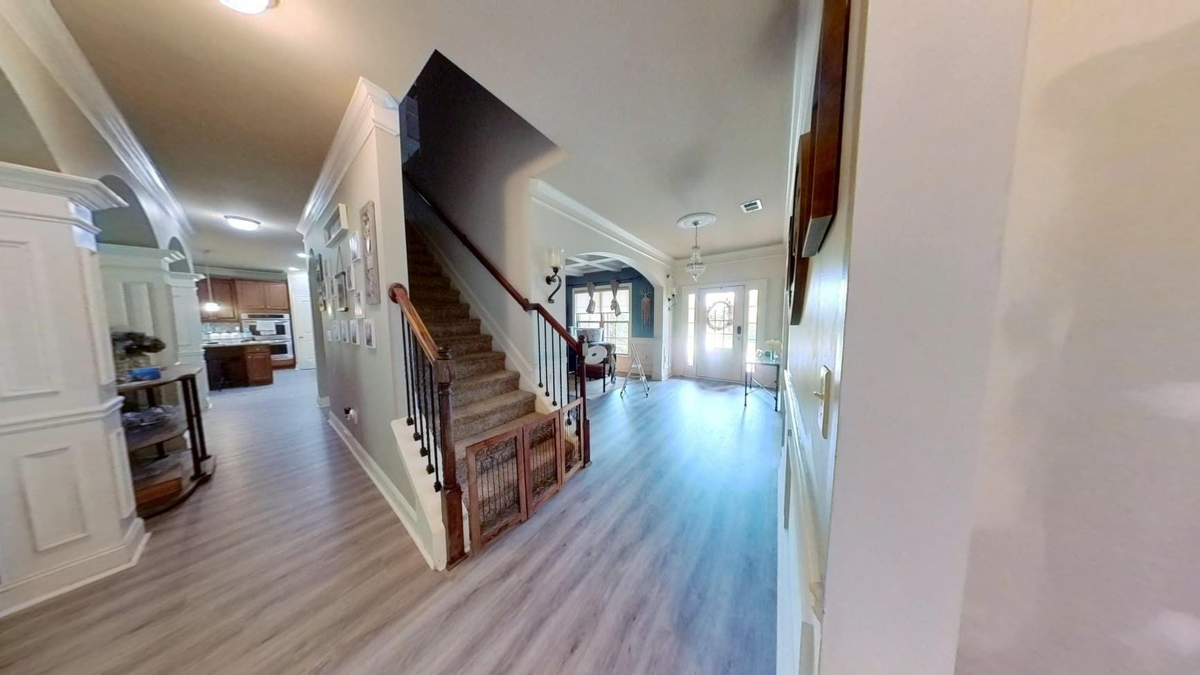 Restored hallway and staircase with new flooring after flood cleanup