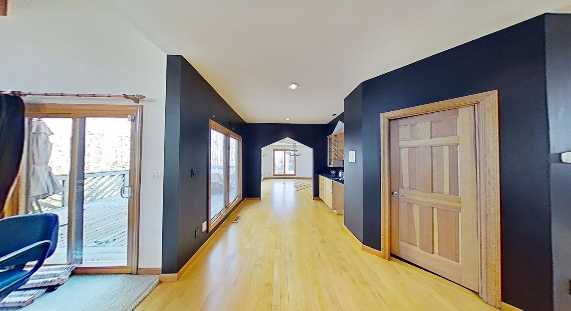 Hallway fully restored with new flooring after water damage restoration