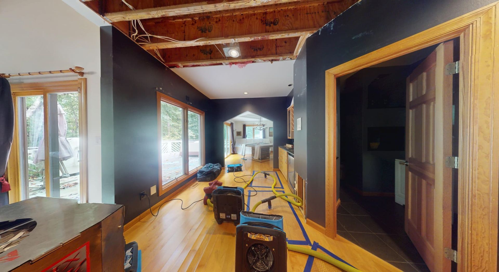 Hallway with saturated carpet and water damage before restoration in Atlanta home