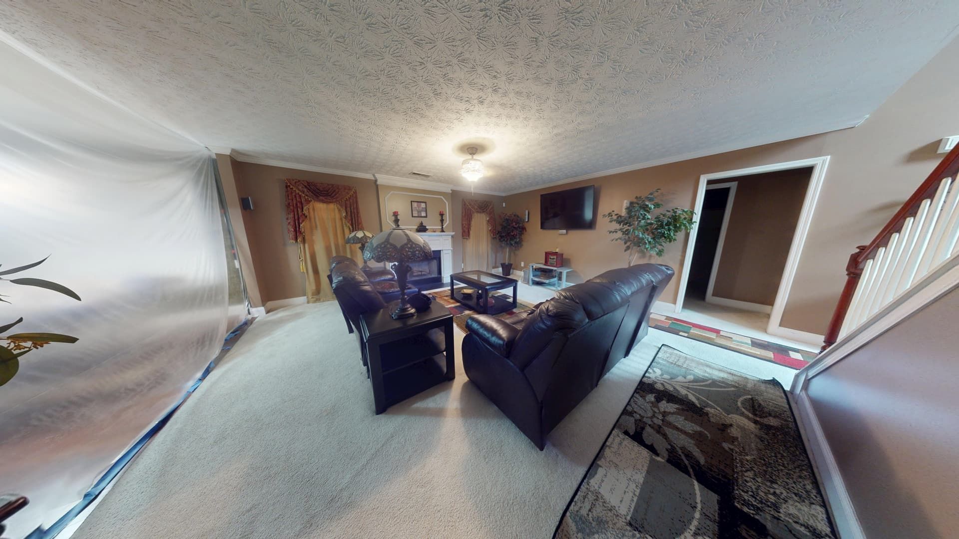Second angle of living room flood damage in Stonecrest showing extent of water intrusion