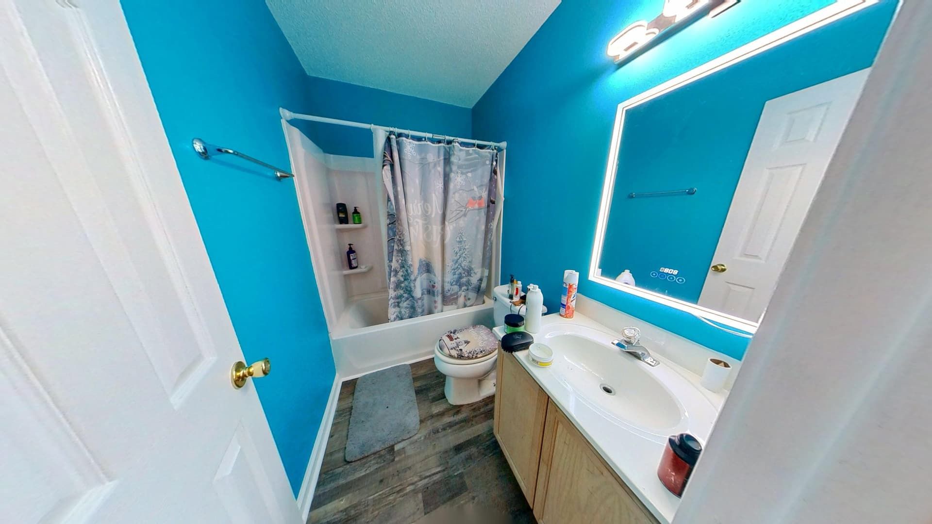 Restored bathroom with new tile and fixtures after water damage restoration