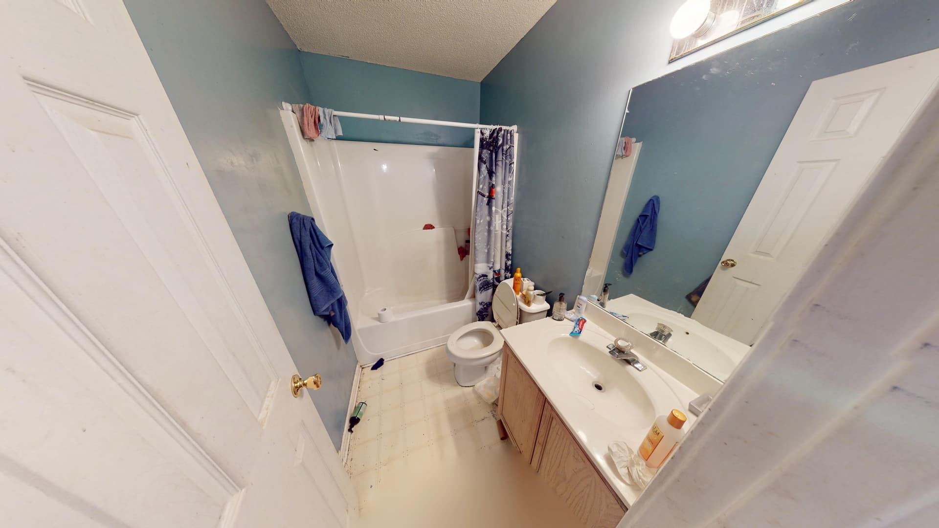 Water-damaged bathroom with saturated flooring before restoration in Lithonia