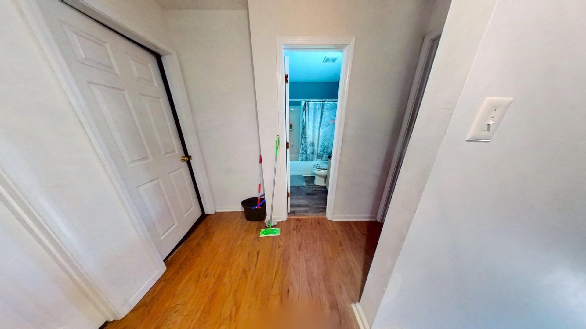 Repaired hallway ceiling with smooth finish and fresh paint after restoration