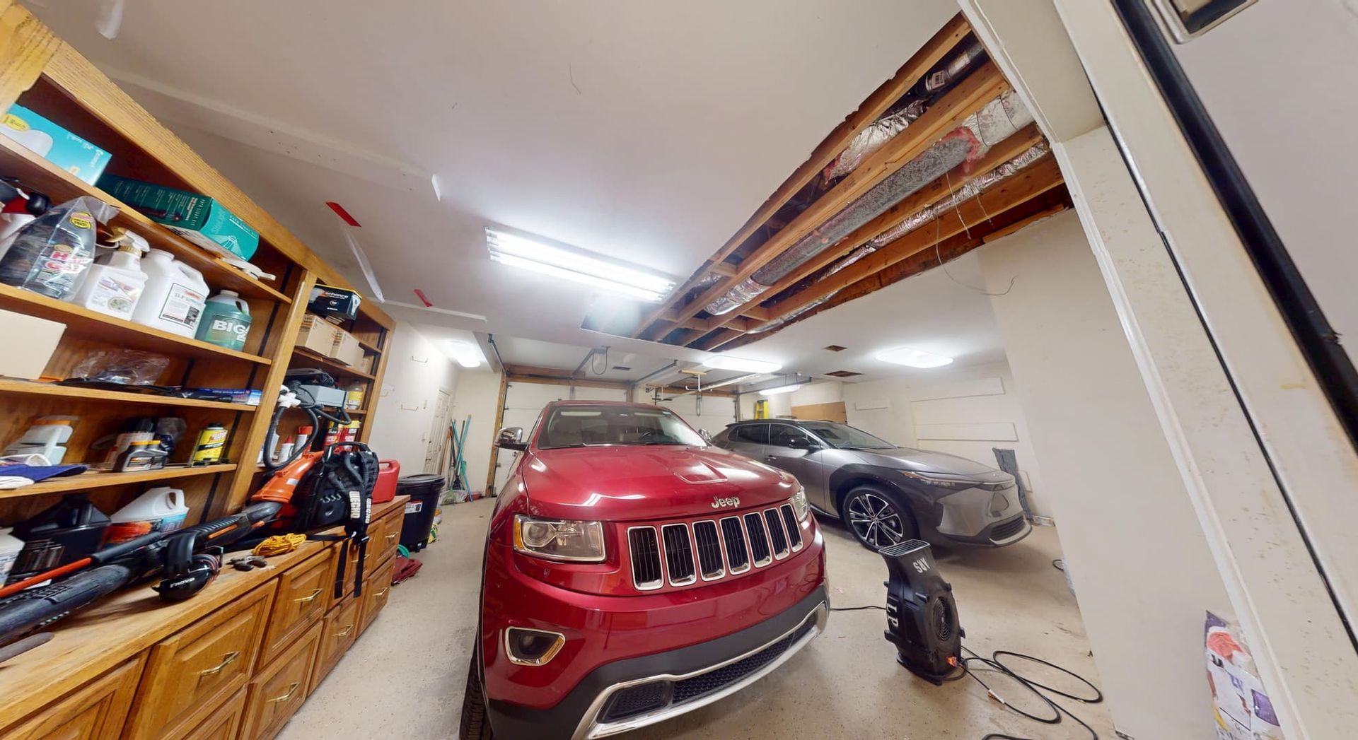 Flooded garage with standing water before cleanup in Atlanta residential property