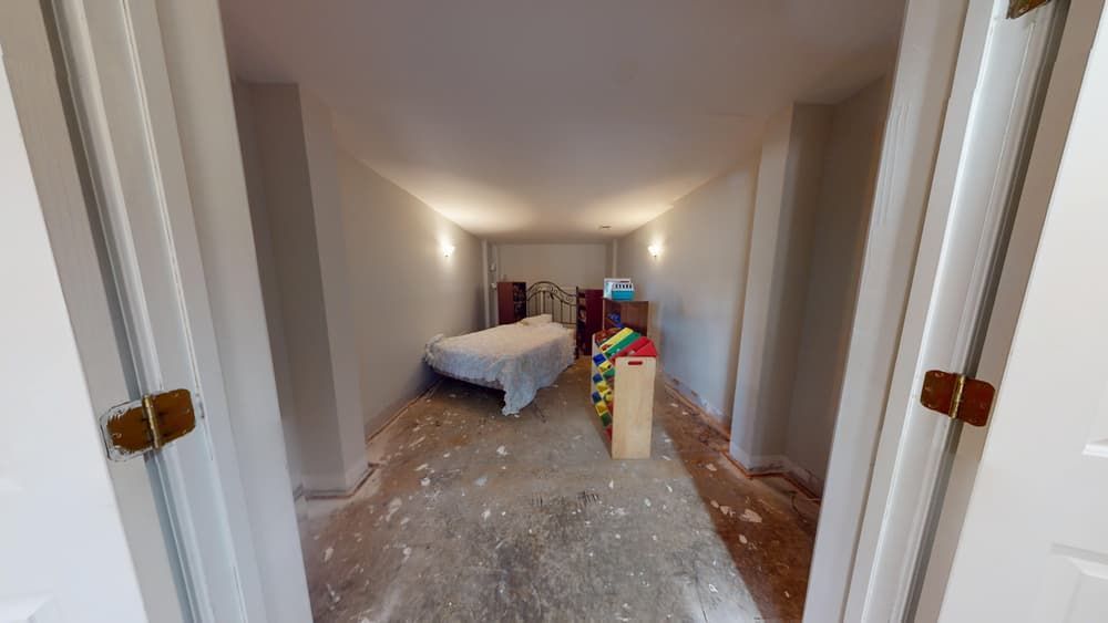 Kids bedroom before water damage restoration showing flood impact